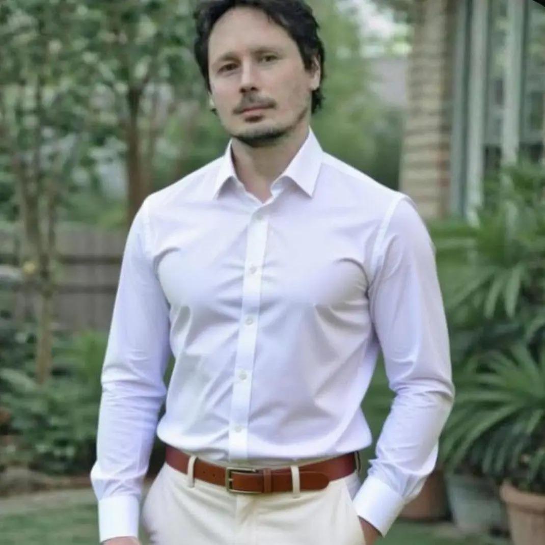 Mark Greer standing outdoors in a white shirt.